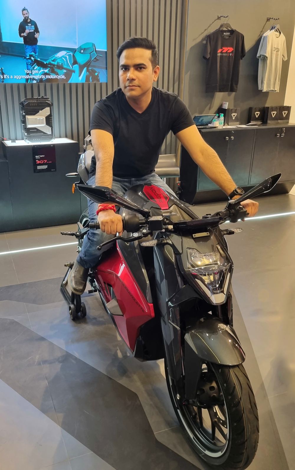 Diwakar on the motorcycle again, this time looking away